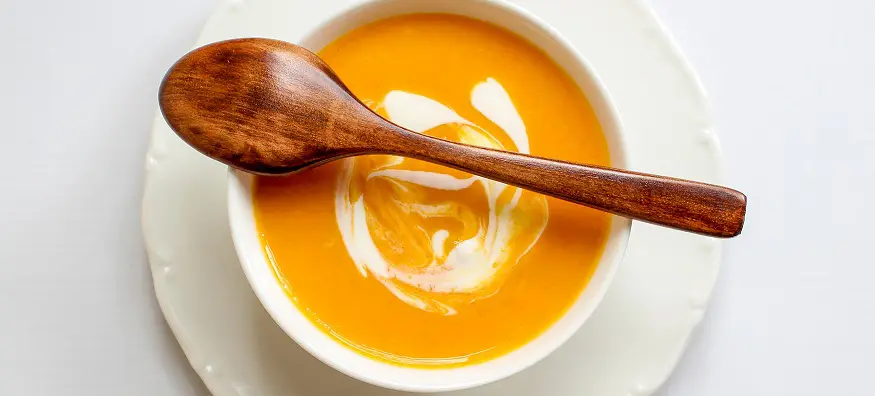 a bowl of carrot soup