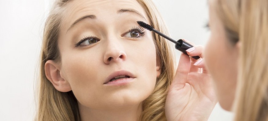 woman applying mascara