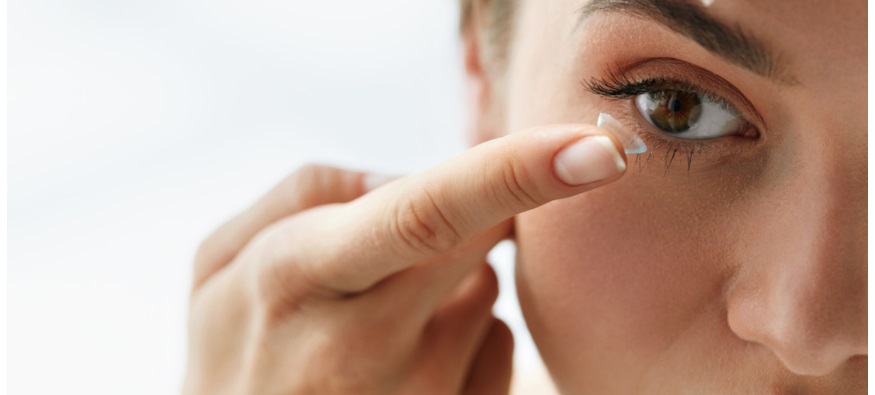 Woman putting in a Contact Lens