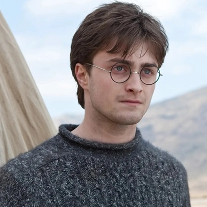 Harry Potter in gold and black glasses