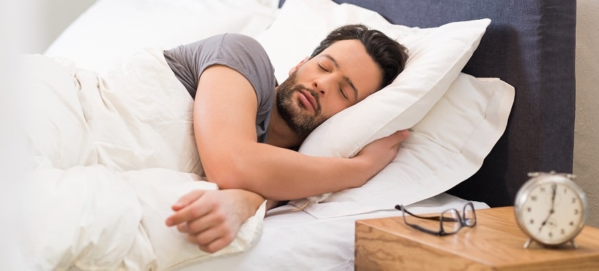 a man sleeping in bed