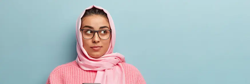 Someone wearing large square optical glasses