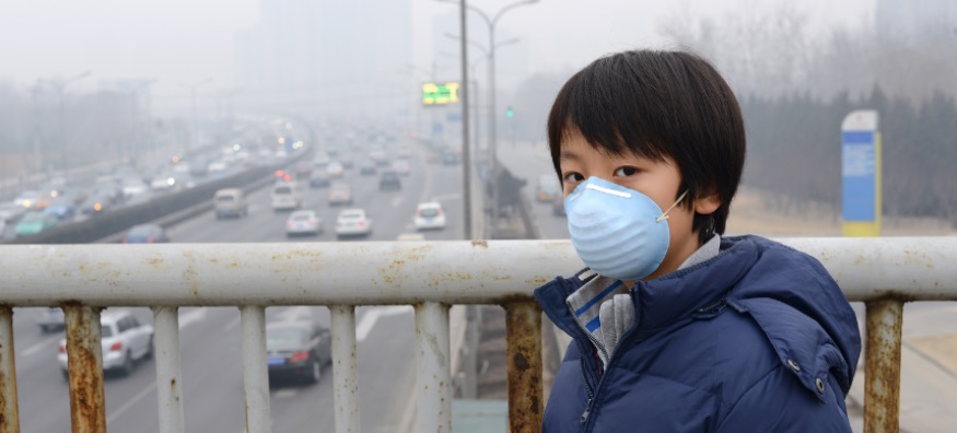 Boy wearing a pollution mask in Beijing
